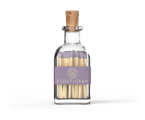 Lilac coloured matches in a stylish glass bottle from Eldstickan for a great interior design idea