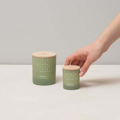 FJORD organic vegan scented candle in 2 sizes of soft green toned glass jar for Nordic home style from Skandinavisk