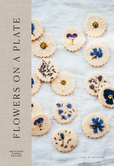 Hardcover book Flowers on a Plate combining floral baking & nature  with beautiful photography of Finnish life, by Cozy Publishing.