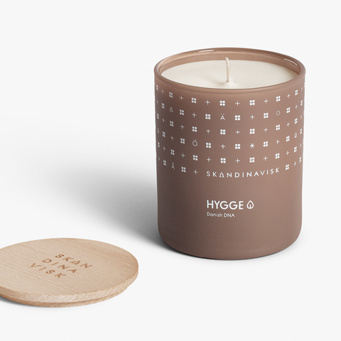 Hygge Organic vegan scented candle in soft toned beige glass jar with wooden lid for Nordic home style from Skandinavisk