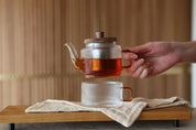 Glass teapot with glass cup