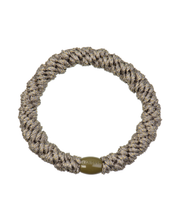 Kknekki camo glitter hair tie with neutral dark beige and gold tones, and dark beige iconic logo bead.