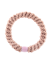 Kknekki dusty rose original hair tie with pale pink iconic logo bead.