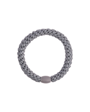 Kknekki mid grey original hair tie with grey iconic logo bead.