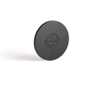 The solid black metal embossed candle lid protects Amoln’s monochromatic blue candles and preserves the scent