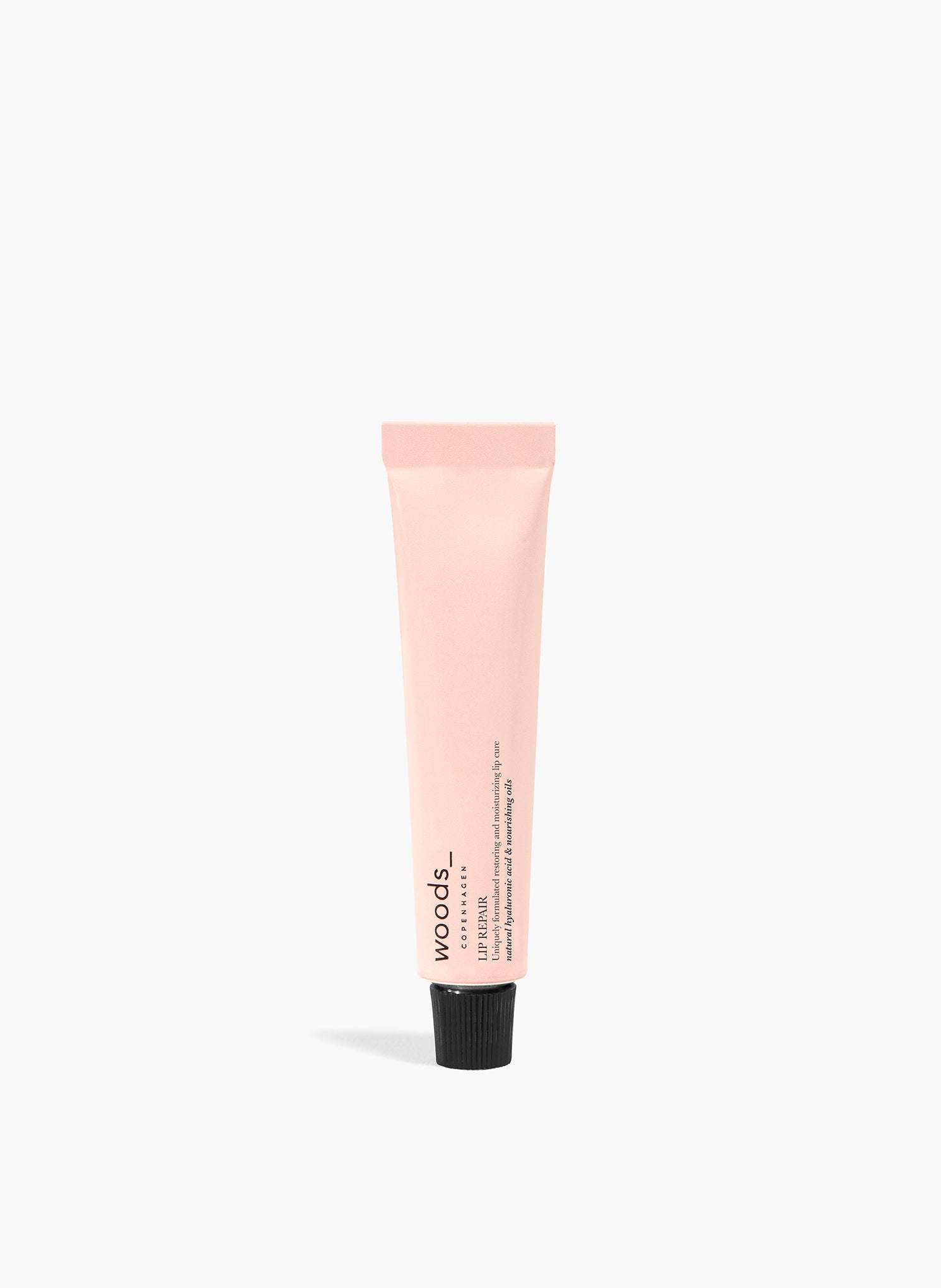 Light pink metal mini tube of mint flavoured lip balm, all natural, organic vegan Lip Repair  for all irritated skin, unisex , made by Woods Copenhagen. (8511228969265)