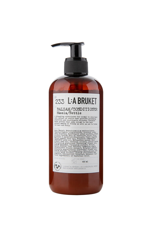 Natural, vegan & organic shampoo with the fresh green scent of nettle in brown pump bottle from the nature of Sweden's West Coast by best selling minimalist L:A Bruket