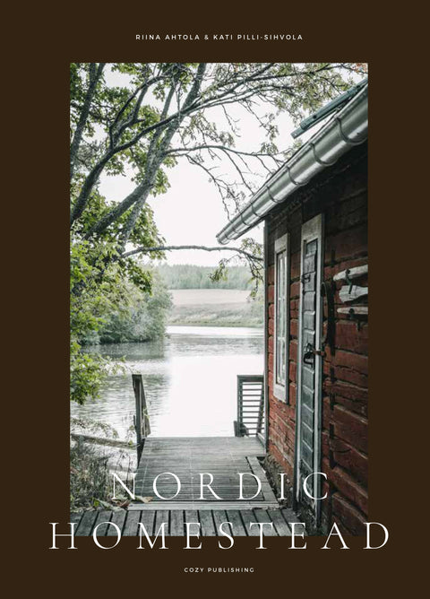 Hardcover book celebrating living close to nature on the Nordic Homestead with beautiful photography of Finnish life, by Cozy Publishing.