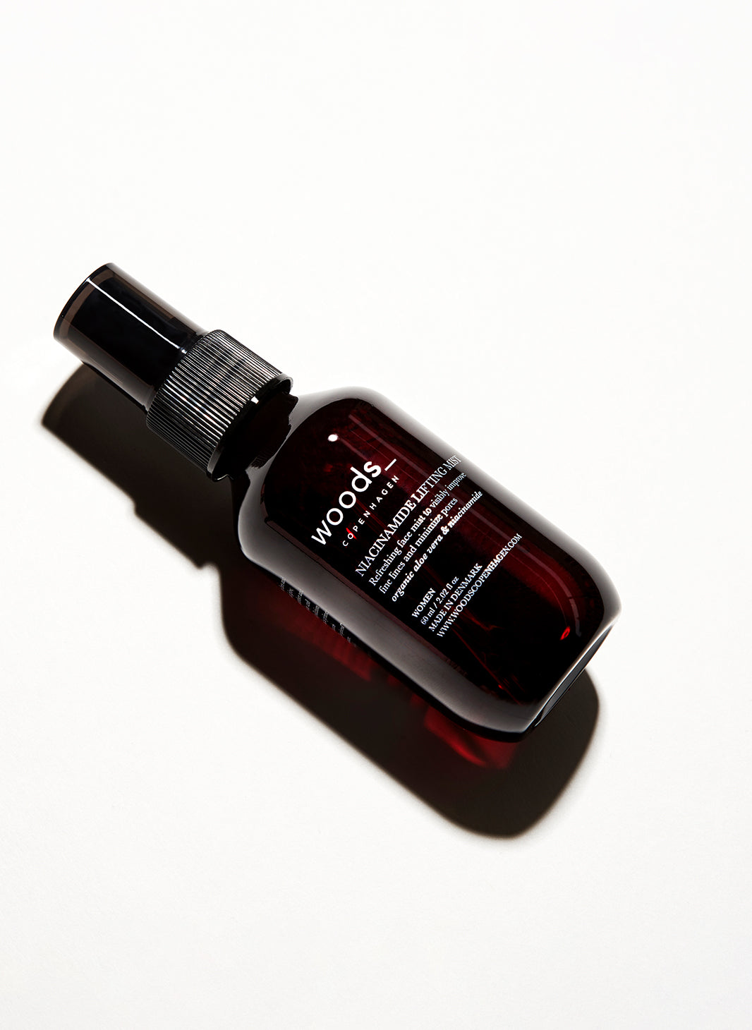 Refresh, hydrate and give an antioxidant boost to the skin with natural, organic vegan Niacinamide Lifting Mist in its brown pump bottle, ideal for all skins, unisex , made by Woods Copenhagen (8511007981873)