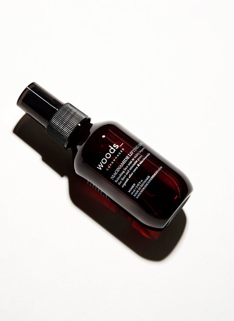 Refresh, hydrate and give an antioxidant boost to the skin with natural, organic vegan Niacinamide Lifting Mist in its brown pump bottle, ideal for all skins, unisex , made by Woods Copenhagen (8511007981873)
