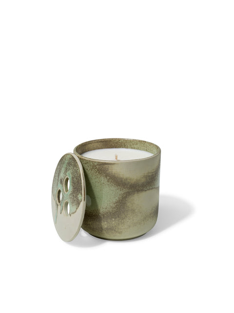 Elegant design and natural sophisticated scent of dry vetiver in this refillable ceramic candle in unique green & beige textured finish from Quod Stockholm, with a distinctive 3 hole ceramic lid
