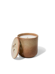 Elegant design and natural sophisticated scent of amber & rose in this refillable ceramic candle in unique rust & beige textured finish from Quod Stockholm, with a distinctive 3 hole ceramic lid