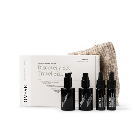 Sleek black glass bottles with stark white text creates a stylish minimalist skincare line from OM-SE. The Discovery Set of 5 products to try or for travel is vegan and totally organic for easy beauty routines, ideal for all skin types.