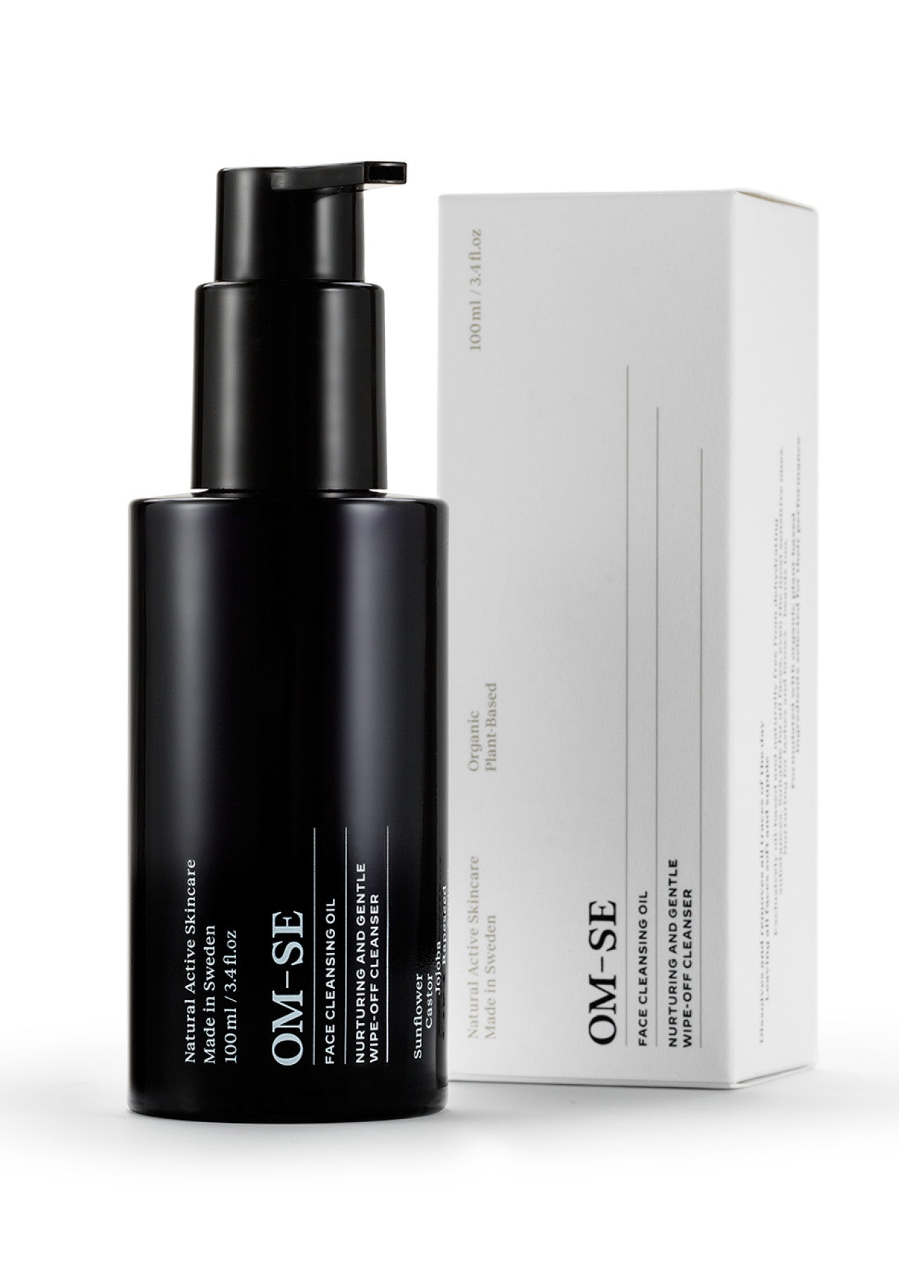 Sleek black glass bottle with stark white text, delivered in sustainable luxury white packaging creates a stylish minimalist skincare line from OM-SE. This cleansing oil is vegan and totally organic for easy beauty routines.