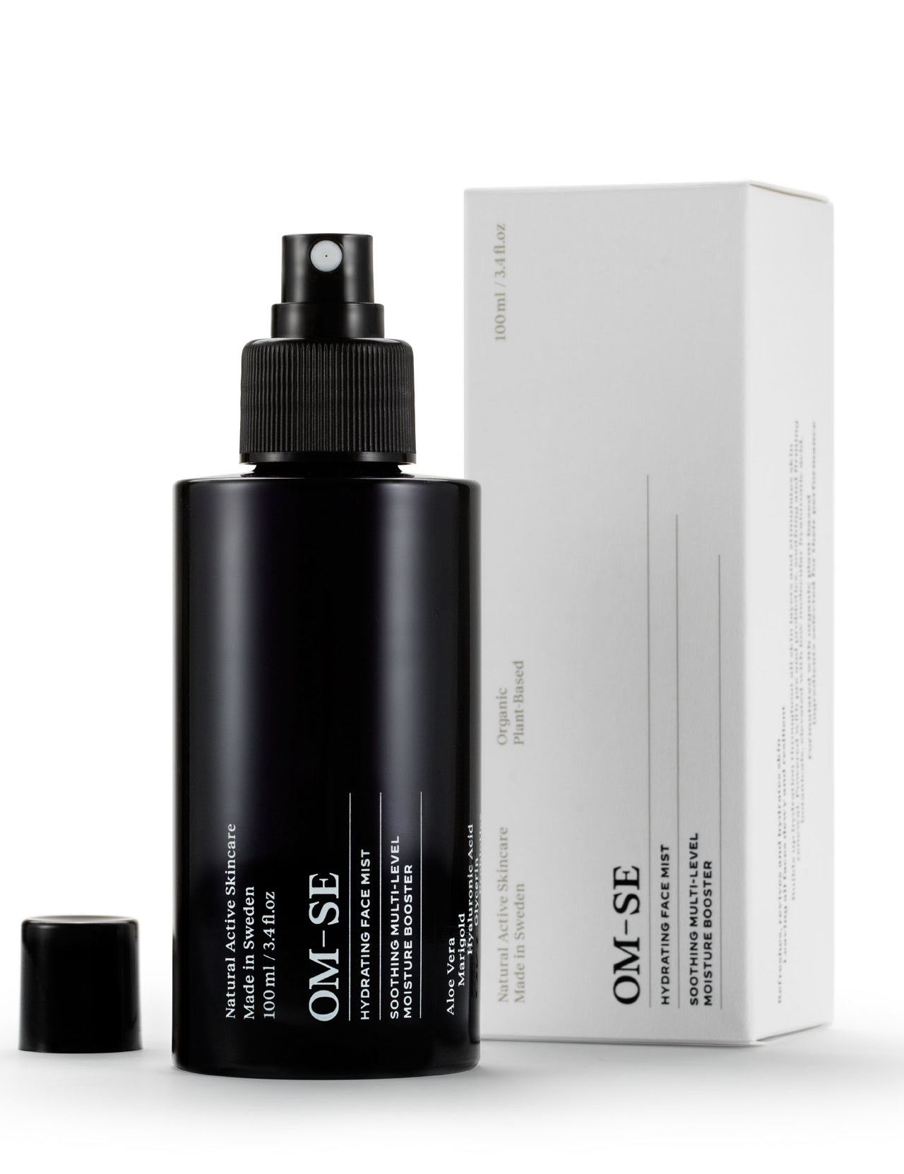 Sleek black glass bottle with stark white text, delivered in white sustainable packaging,  creates a stylish minimalist skincare line from OM-SE. This hydrating facial mist is vegan and totally organic for easy beauty routines.