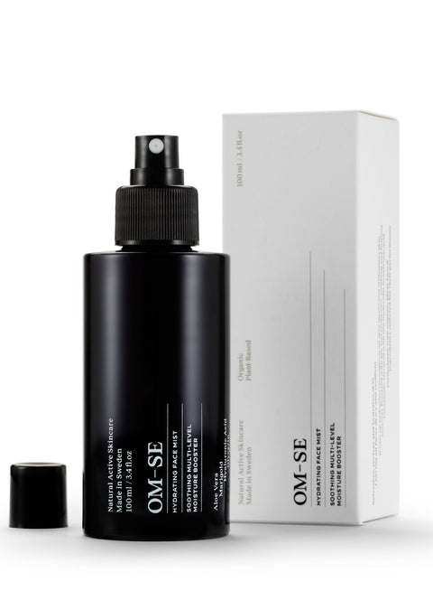 Sleek black glass bottle with stark white text, delivered in white sustainable packaging,  creates a stylish minimalist skincare line from OM-SE. This hydrating facial mist is vegan and totally organic for easy beauty routines.