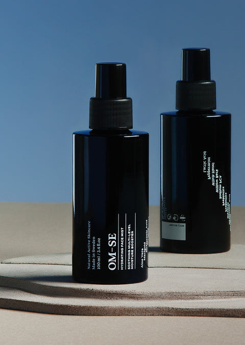 Sleek black glass bottle with stark white text creates a stylish minimalist skincare line from OM-SE. This hydrating facial mist is vegan and totally organic for easy beauty routines.