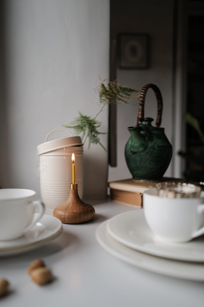 Simple and elegant, stylish hand turned oak candle holders for thin beeswax taper candles from Ovo Things