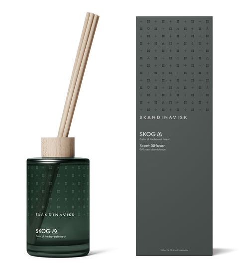 SKOG forest scent diffuser of organic vegan room fragrance with 8 sticks in dark green coloured glass jars for the best in Nordic home style from Skandinavisk