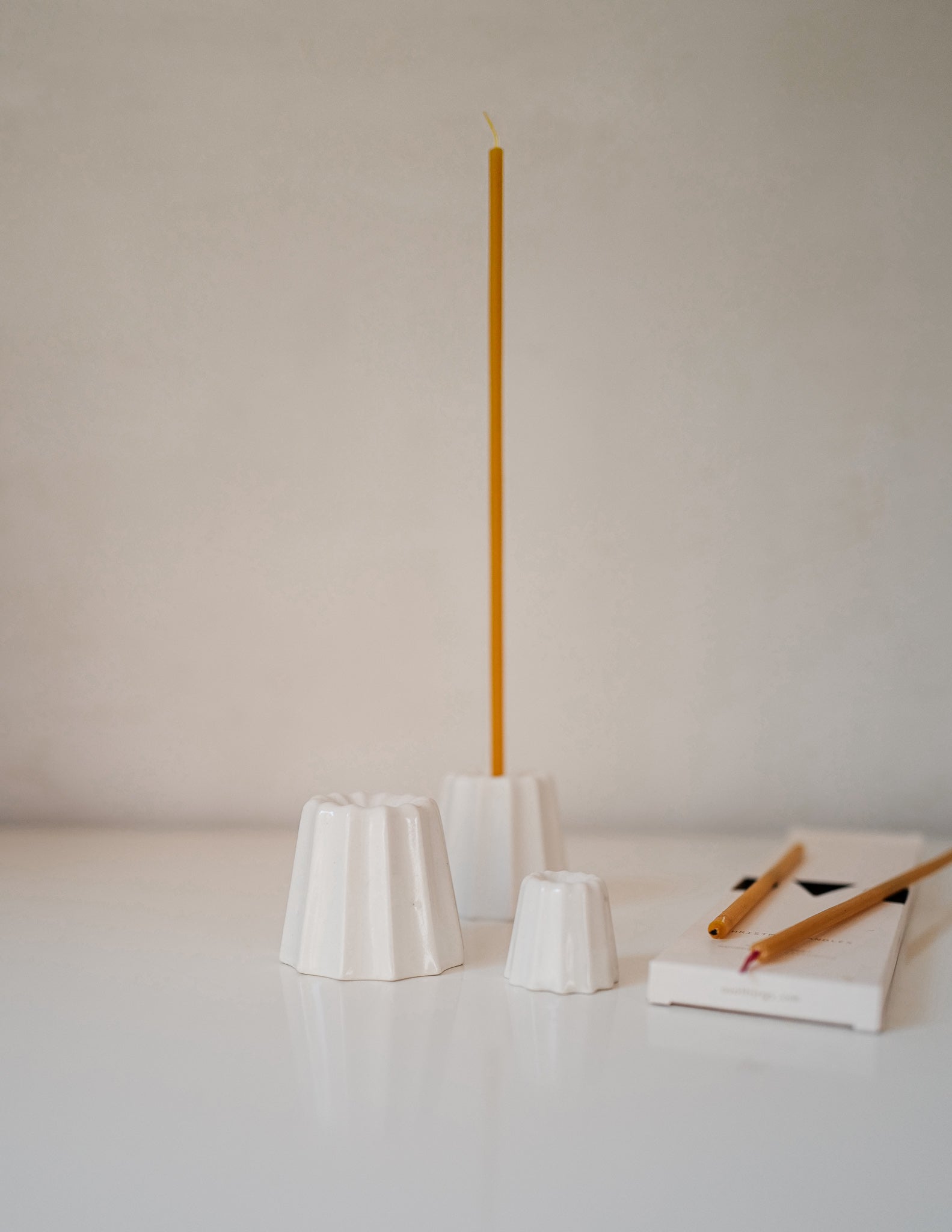 Ceramic hand cast candle holder in white glaze for long thin candles from Ovo Things