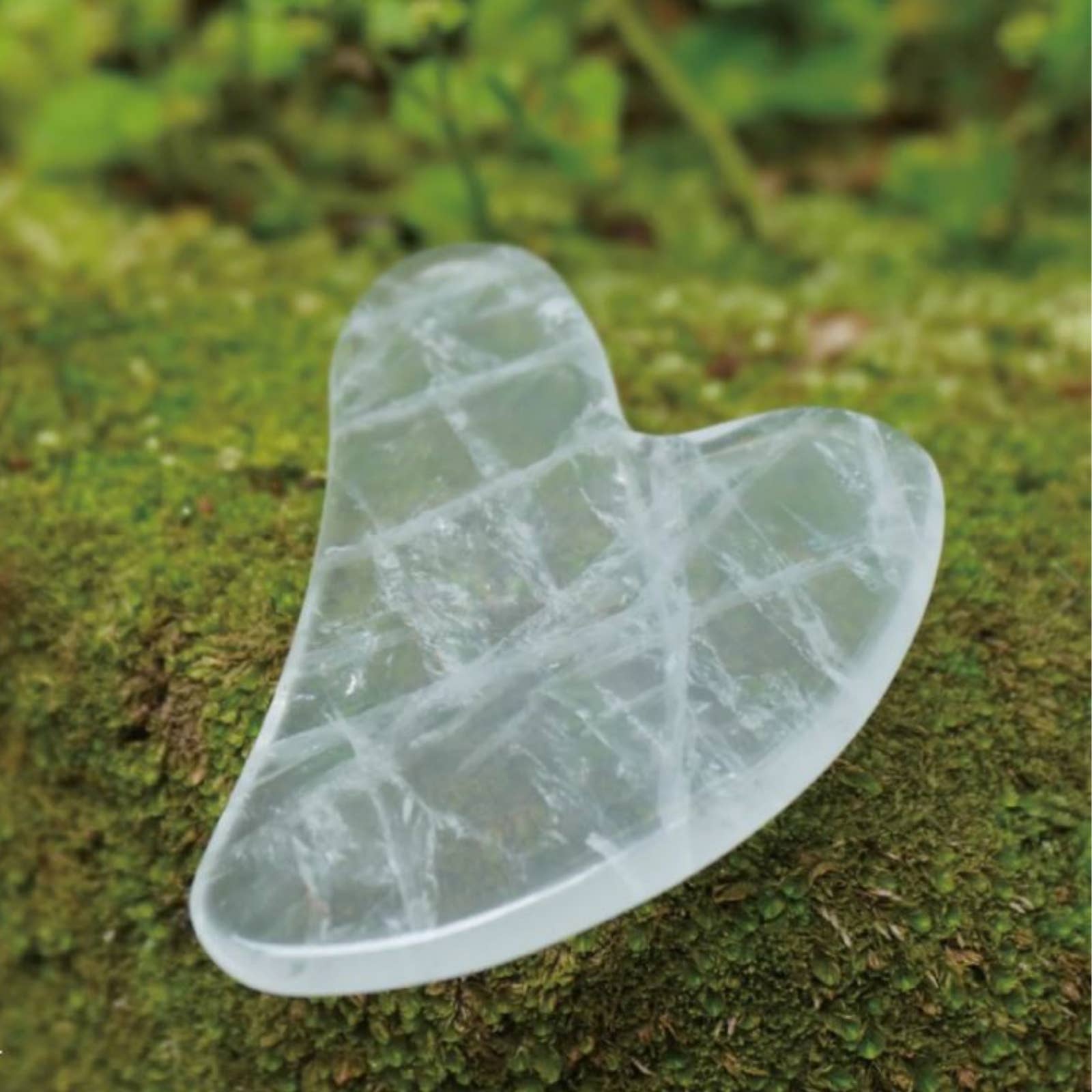 Rock crystal gua sha stone for facial massage and home treatment rituals