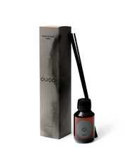 Elegant design and natural sophisticated scent in the smokey grey box, of room diffuser No 1 Black Wood from Quod Stockholm, with distinctive black bottle & sticks