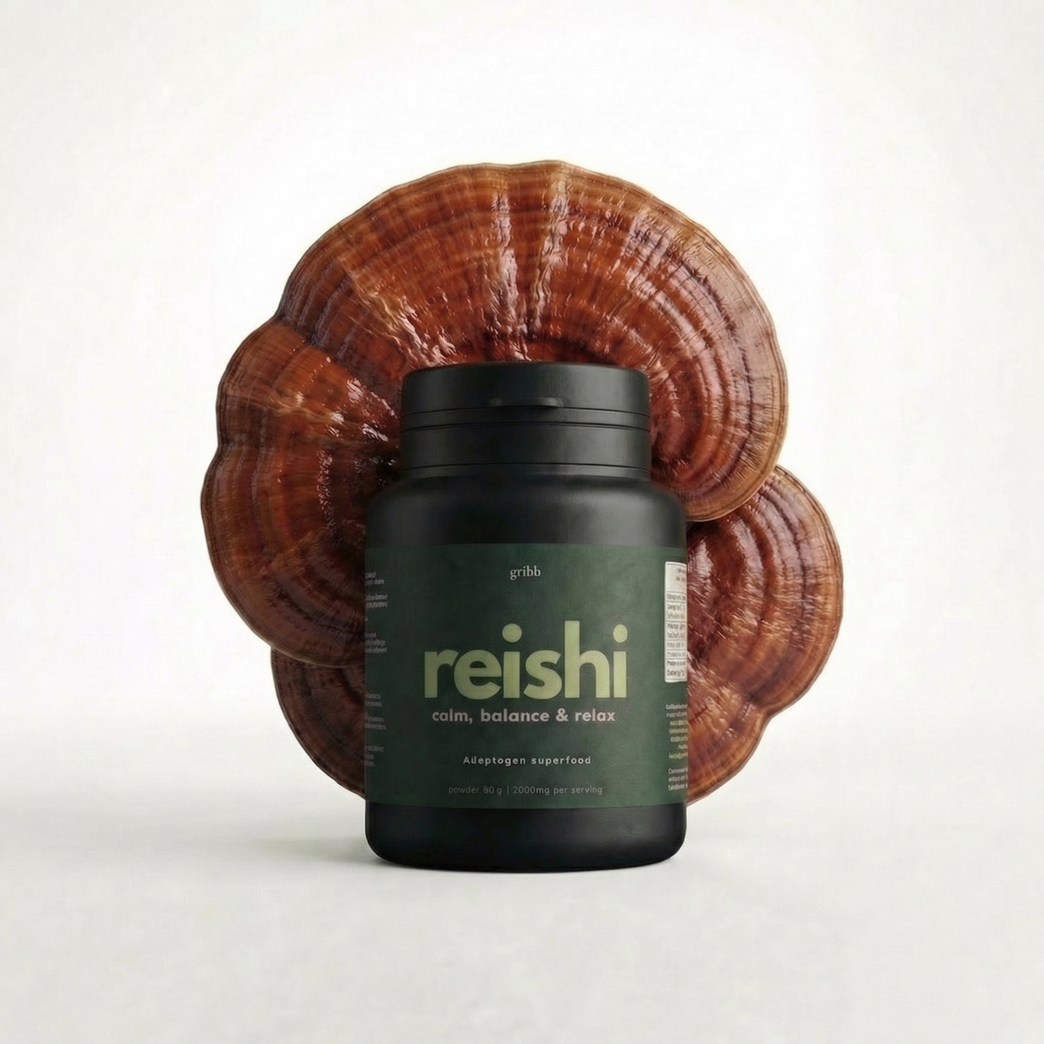 Reishi mushroom powder supplement bottle with a large reishi mushroom on a white background