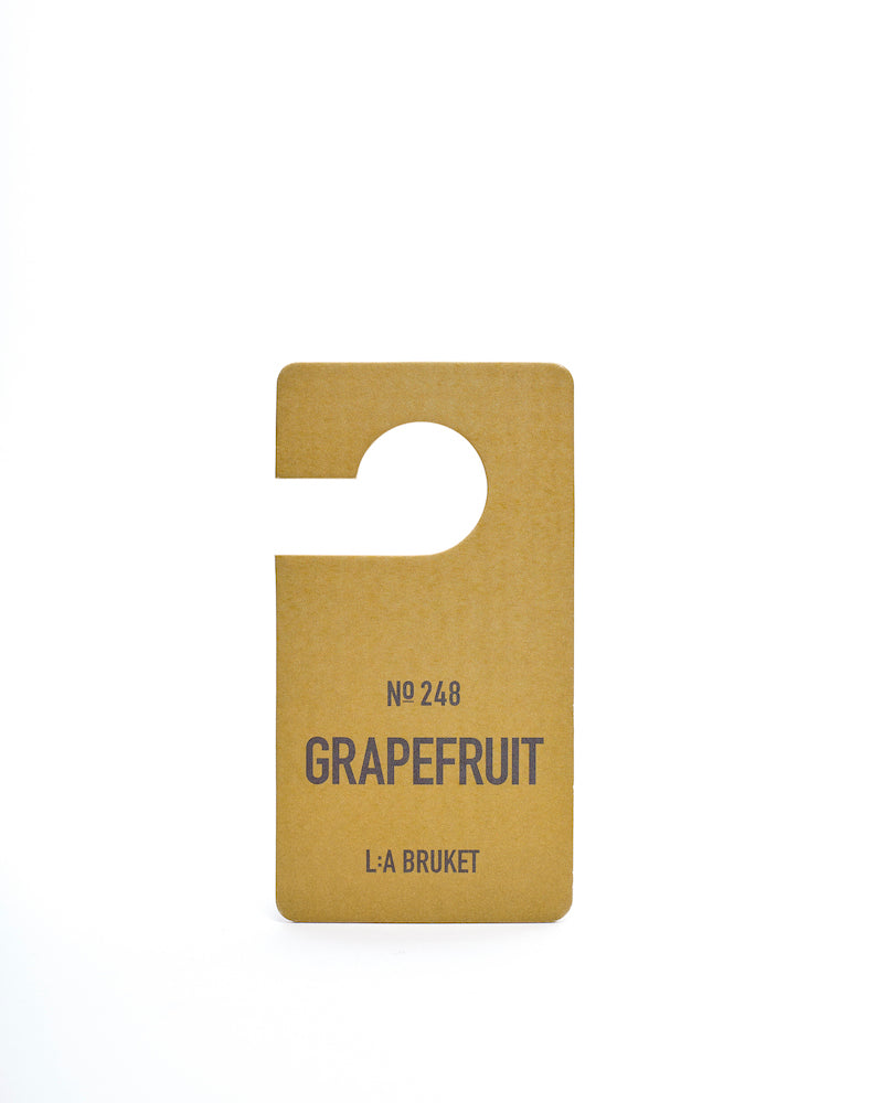 All natural, organic and vegan room scent on hanging tag with the citrus scent of Grapefruit from the best of Sweden's coastal home fragrance brand, L:A Bruket