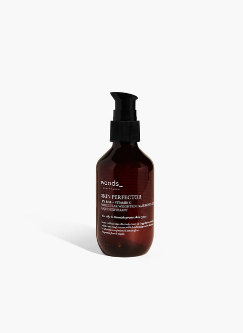 Gentle exfoliation and renewed skin with natural, organic vegan Skin Perfector in its brown pump bottle, ideal for all skins, unisex , made by Woods Copenhagen