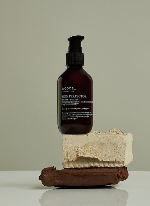 Gentle exfoliation and renewed skin with natural, organic vegan Skin Perfector in its brown pump bottle, ideal for all skins, unisex , made by Woods Copenhagen