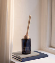 HAV sea breeze scent diffuser of organic vegan room fragrance with 8 sticks in navy blue coloured glass jars for the best in Nordic home style from Skandinavisk