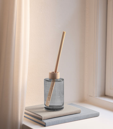 ØY scent diffuser of organic vegan room fragrance with 8 sticks in soft blue coloured glass jars for the best in Nordic home style from Skandinavisk