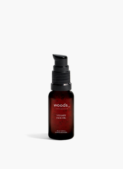 a multi vitamin and antioxidant boost to the skin with natural, organic vegan Vitamin face Oil in its brown pump bottle, ideal for all skins, unisex , made by Woods Copenhagen