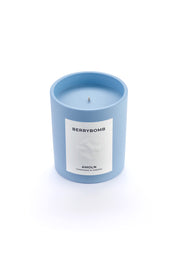 Signature blue candle in the same sky blue ceramic jar, inspired by Scandinavian skies, in the scent Berrybomb - a blend of fruits, florals, leather & musk from Amoln, makers of Sweden's royal candles.