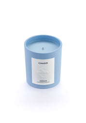 Signature blue candle in the same sky blue ceramic jar, inspired by Scandinavian skies, in the scent Chado - a blend of citrus,  flowers, tea & exotic woods  from Amoln, makers of Sweden's royal candles.