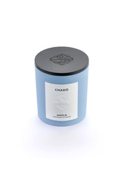 Signature blue candle in the same sky blue ceramic jar, inspired by Scandinavian skies, in the scent Chado - a blend of citrus, flowers, tea & exotic woods from Amoln, makers of Sweden's royal candles.