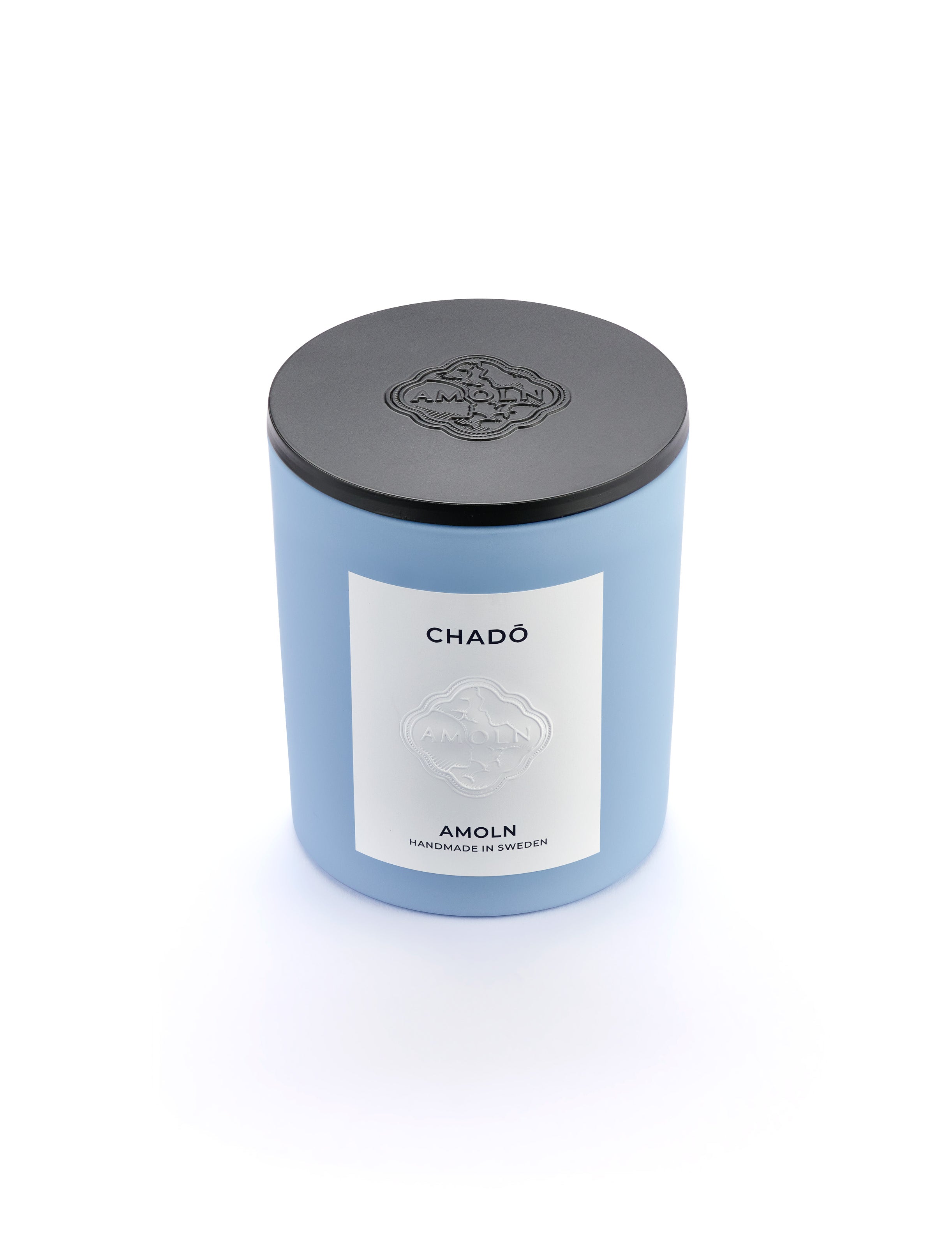 Signature blue candle in the same sky blue ceramic jar, inspired by Scandinavian skies, in the scent Chado - a blend of citrus, flowers, tea & exotic woods from Amoln, makers of Sweden's royal candles.