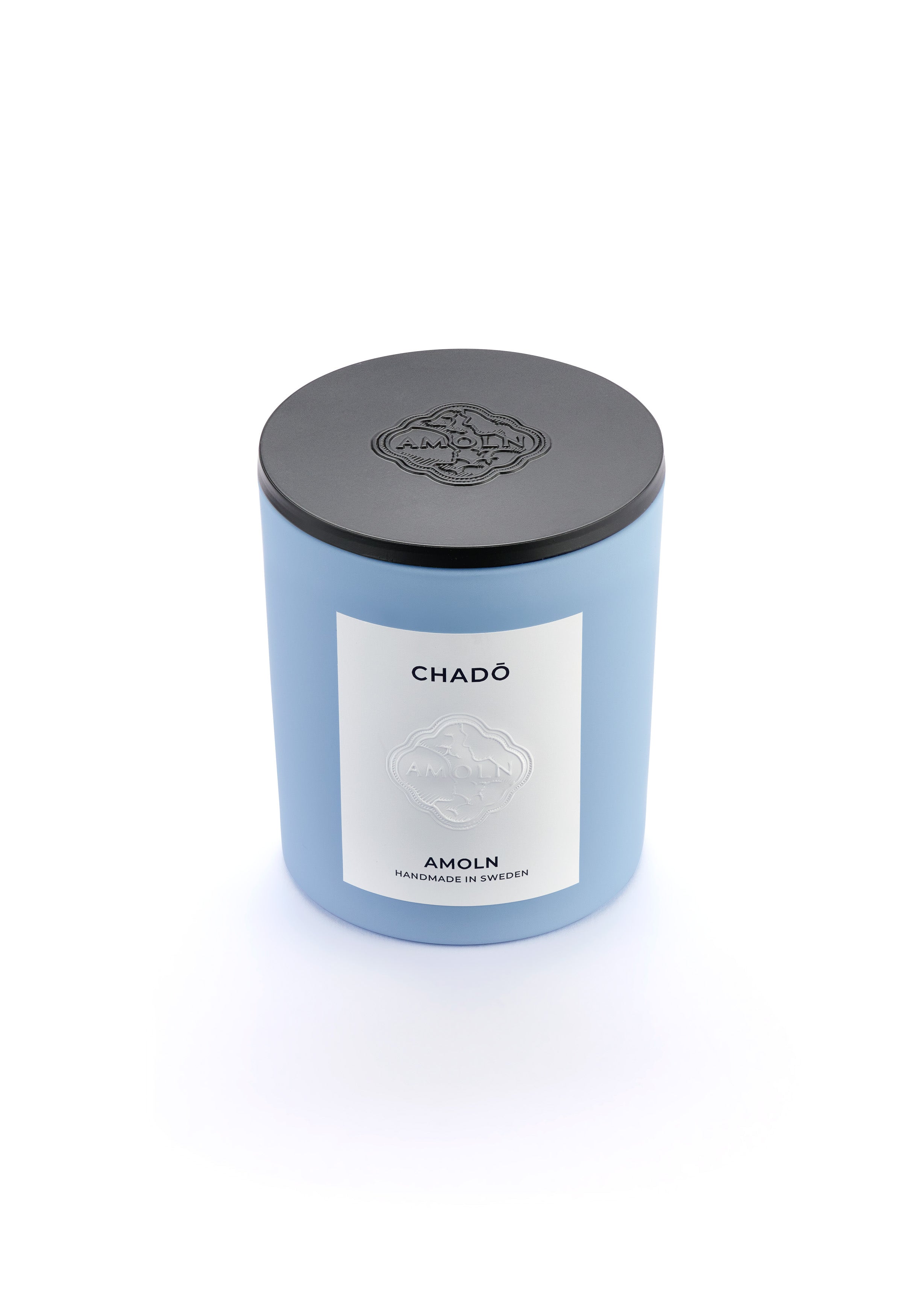 Signature blue candle in the same sky blue ceramic jar, inspired by Scandinavian skies, in the scent Chado - a blend of citrus, flowers, tea & exotic woods from Amoln, makers of Sweden's royal candles.