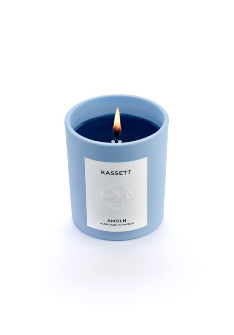 Signature blue candle in the same sky blue ceramic jar, inspired by Scandinavian skies, in the scent Kassett - a blend of fruits, foliage & flowers from Amoln, makers of Sweden's royal candles.