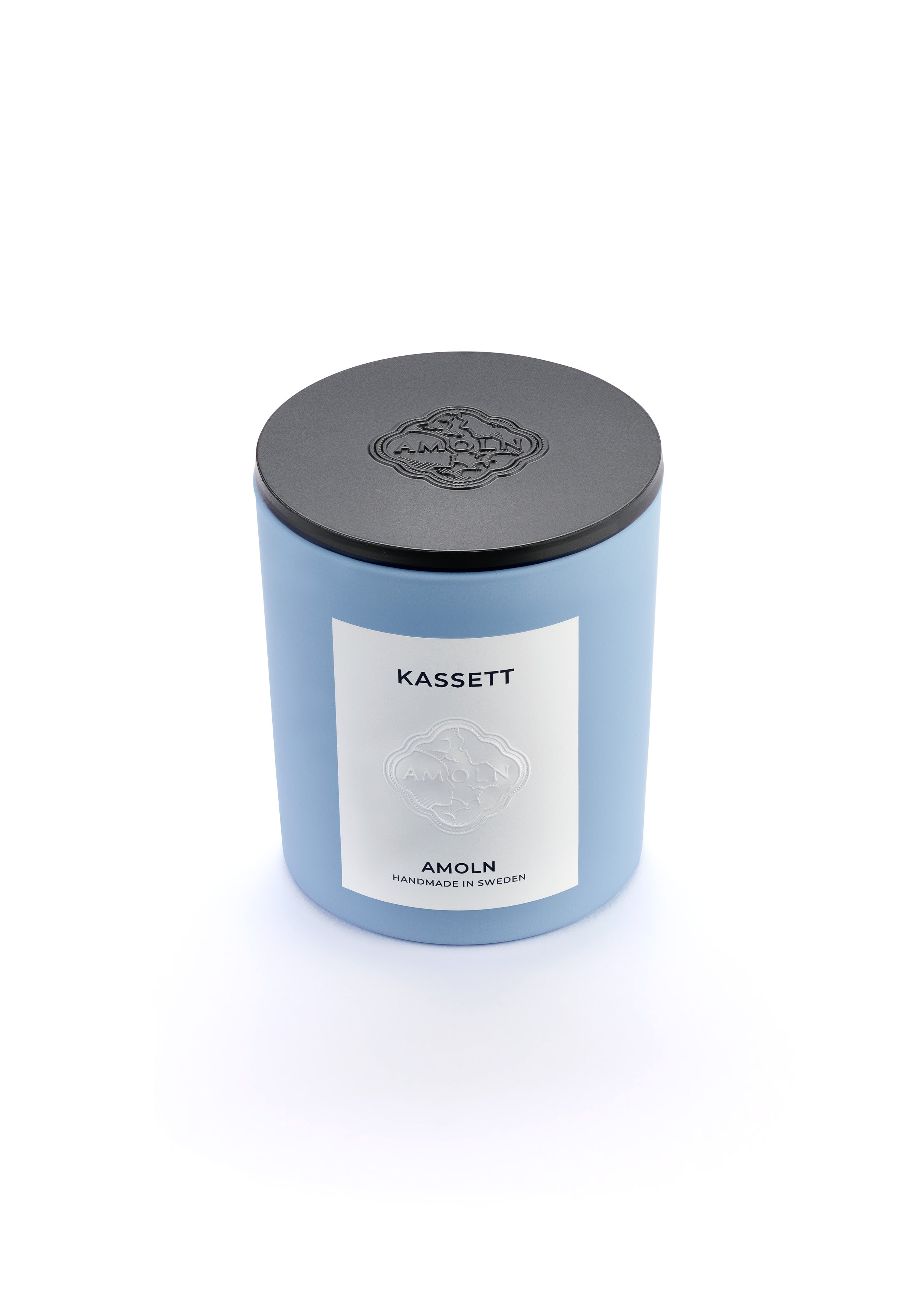 Signature blue candle in the same sky blue ceramic jar, inspired by Scandinavian skies, in the scent Kassett - a blend of fruits, foliage & flowers from Amoln, makers of Sweden's royal candles.