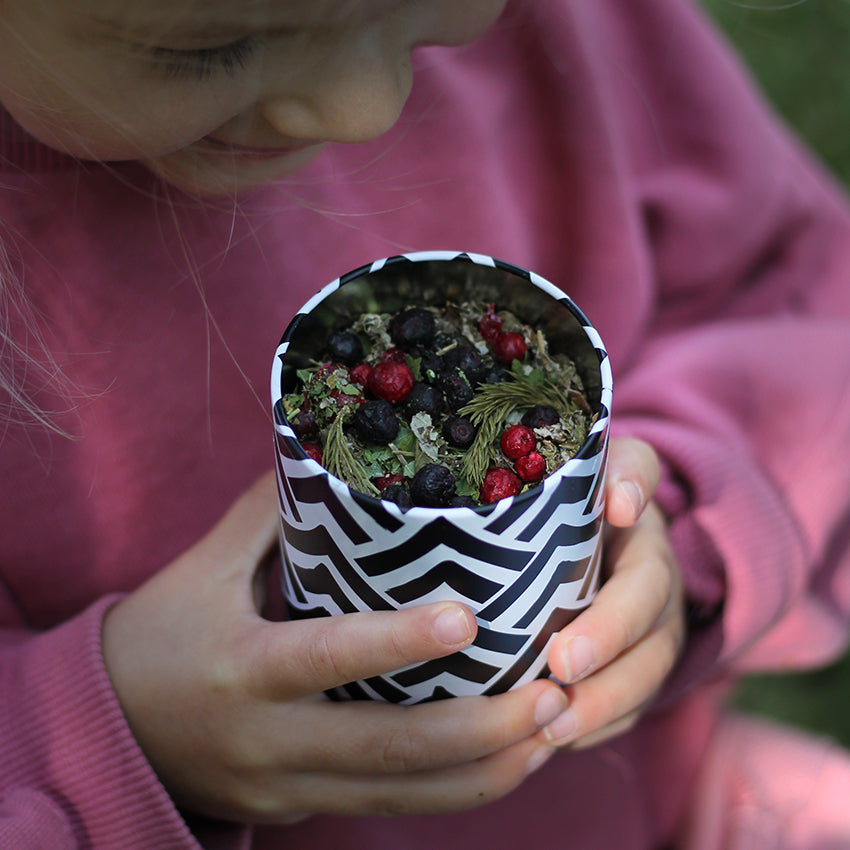 Natural berries from Finland's forest for an organic herbal tea blend in a collectable tin