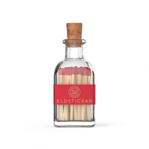 Red coloured matches in a stylish glass bottle from Eldstickan for a great interior design idea