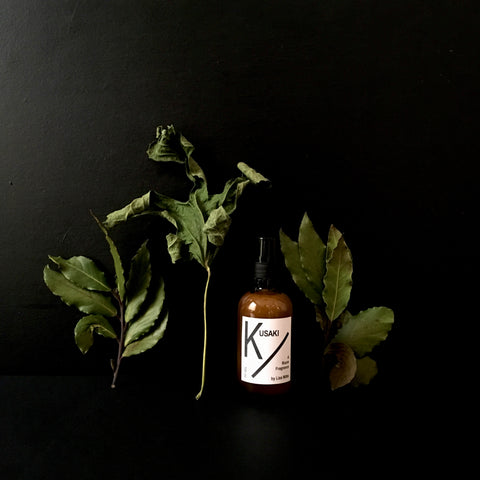 Brown glass spray bottle or room mist with the scent of light fresh green forests from Liza Witte