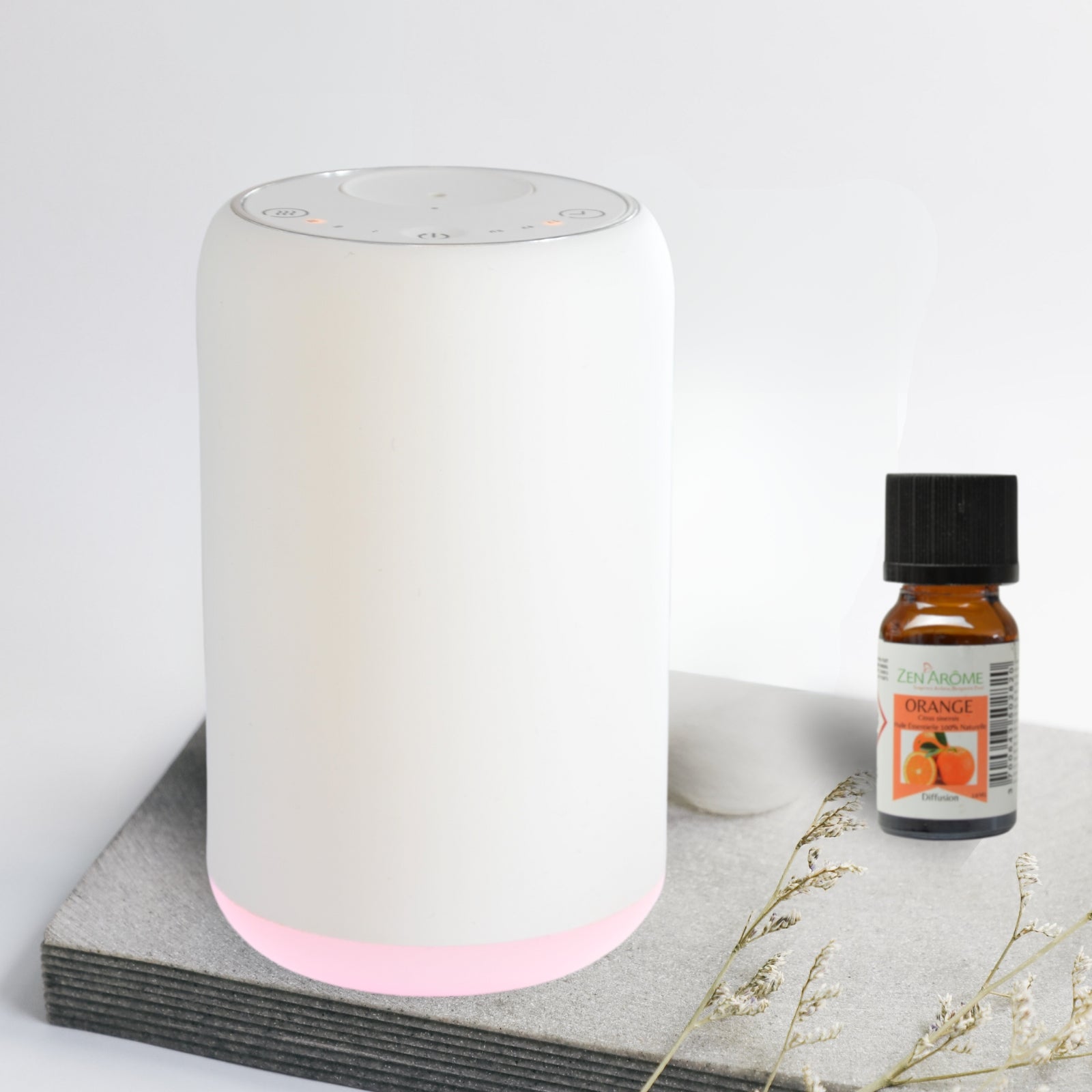 Modern white portable essential oil diffuser, ideal to use in the car, at your desk or anywhere without the need for a cable or wall outlet. No water - simply screw in the essential oil 10ml bottle. Model with coloured light option.