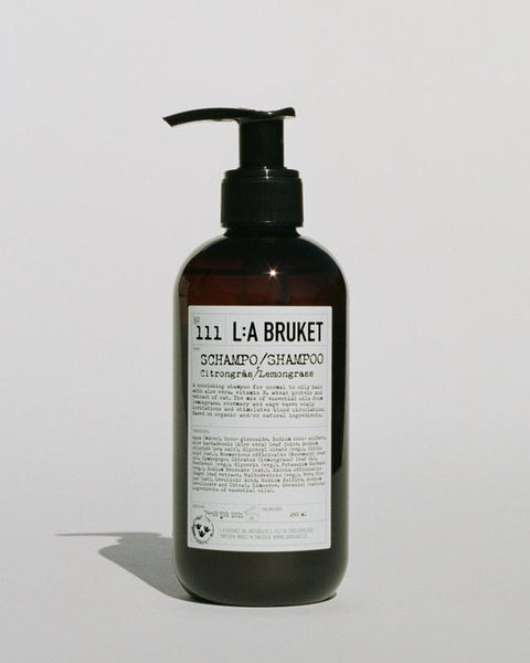 Natural, vegan & organic shampoo with scent of lemongrass in brown pump bottle from the nature of Sweden's West Coast by the best selling minimalist L:A Bruket
